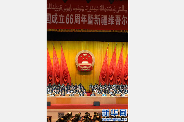 10月1日，慶祝中華人民共和國成立66周年暨新疆維吾爾自治區成立60周年大會在新疆人民會堂隆重舉行。 新華社記者 高潔 攝 