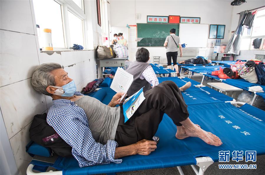 (在習近平新時代中國特色社會主義思想指引下——新時代新作為新篇章·習近平總書記關切事·圖文互動)(5)戰疫魔,斗洪魔——湖北全力應對防疫、防汛疊加“雙考”